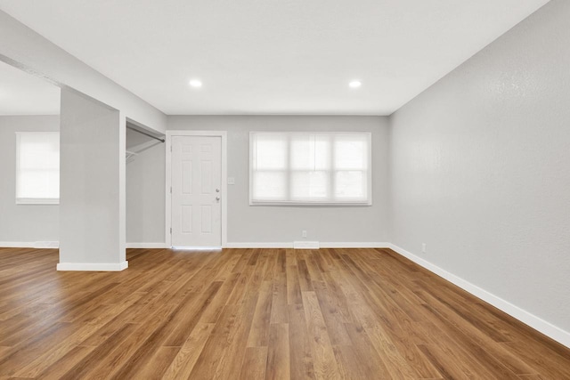 interior space with light hardwood / wood-style floors and plenty of natural light