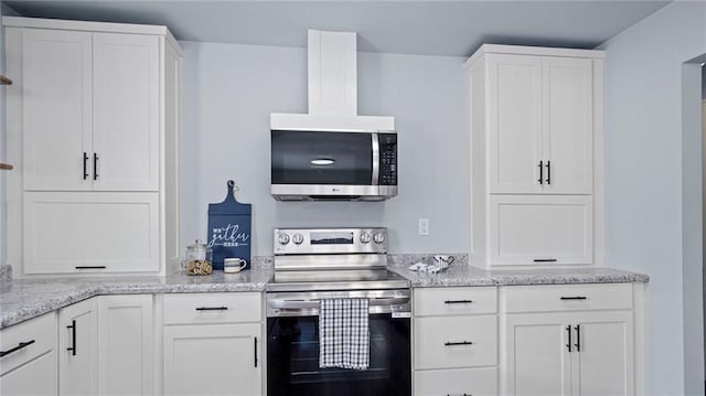 kitchen featuring white cabinetry, ventilation hood, light stone counters, and electric range