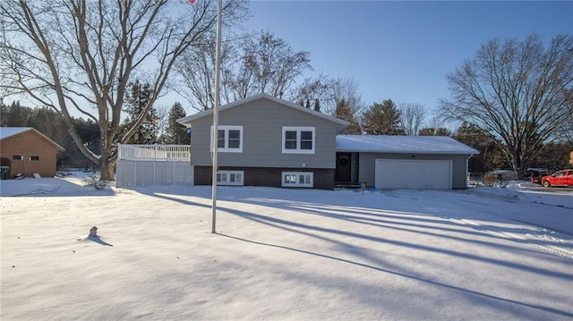 split level home featuring a garage