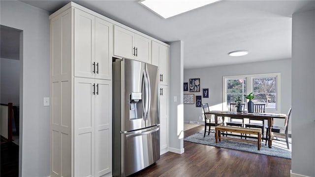 kitchen featuring white cabinetry, stainless steel refrigerator with ice dispenser, and dark wood-type flooring