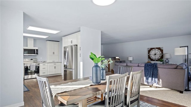 dining room with dark wood-type flooring