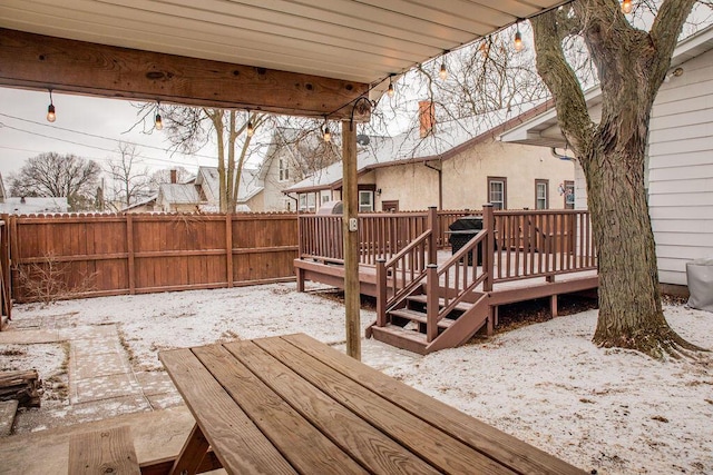 view of snow covered deck