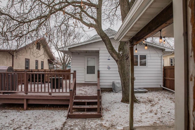 back of house with a deck