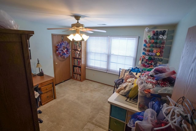 bedroom with ceiling fan and light colored carpet