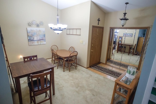 dining area featuring an inviting chandelier