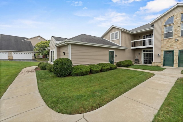 view of front of house with a front lawn and a garage