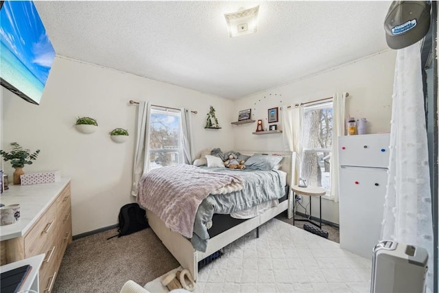 carpeted bedroom with a textured ceiling