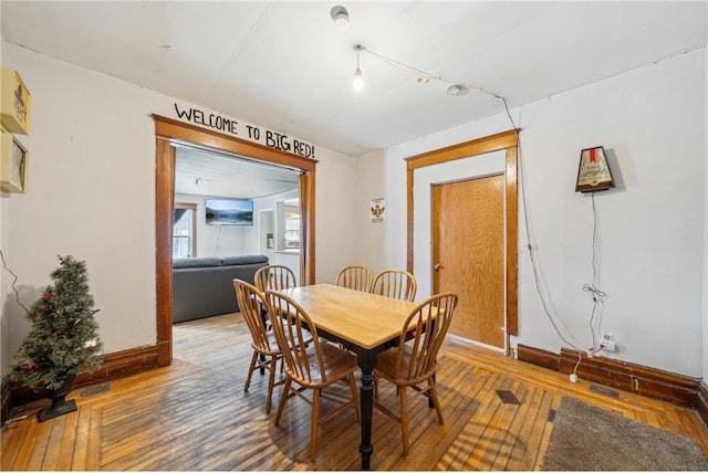 dining space featuring hardwood / wood-style flooring