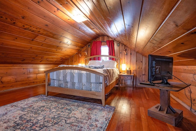 bedroom featuring lofted ceiling, wooden walls, and wooden ceiling