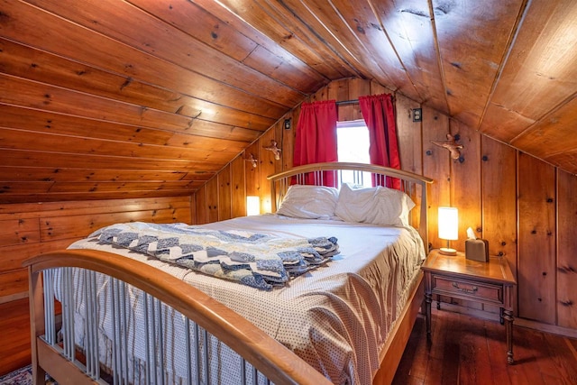 bedroom with dark wood-type flooring, wood walls, vaulted ceiling, and wooden ceiling