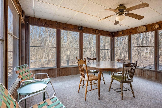 sunroom featuring ceiling fan