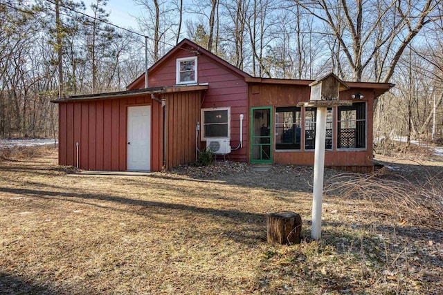 exterior space with cooling unit and a sunroom