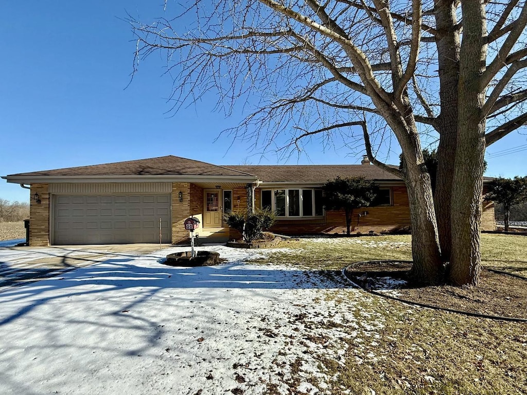 ranch-style home featuring a garage