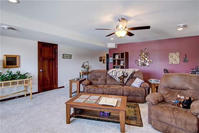 living room with ceiling fan and light carpet