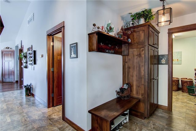 corridor with lofted ceiling