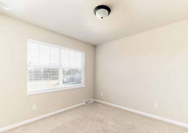 unfurnished room with carpet flooring