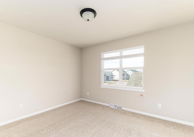 unfurnished room featuring carpet flooring