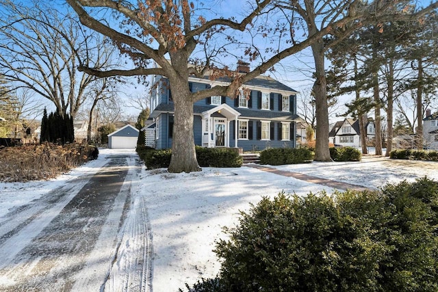 view of front of house with an outbuilding and a garage