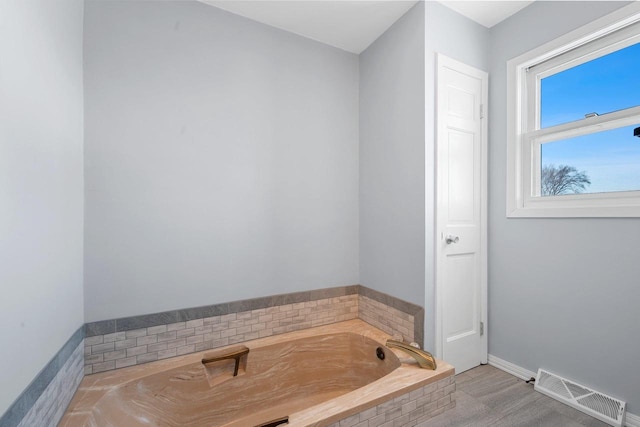 bathroom featuring a tub