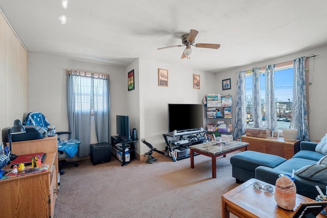 living room featuring ceiling fan and light colored carpet