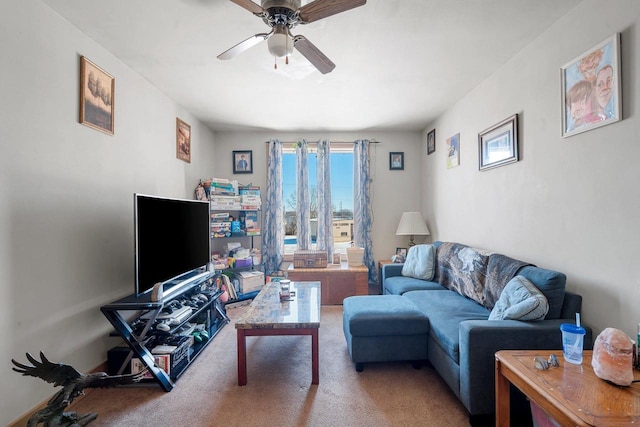 living room with ceiling fan and carpet