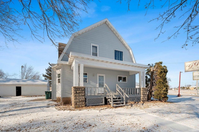 back of property featuring covered porch