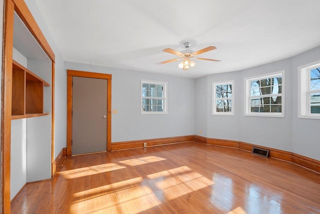 unfurnished room featuring ceiling fan and light hardwood / wood-style floors