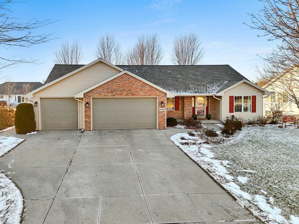 ranch-style house featuring a garage