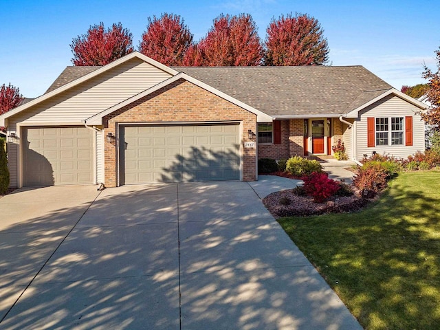 ranch-style house featuring a front yard and a garage