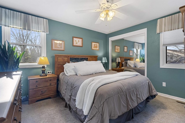 bedroom featuring ceiling fan and light carpet