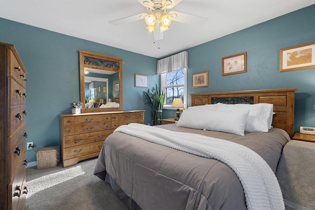 bedroom with ceiling fan and carpet floors