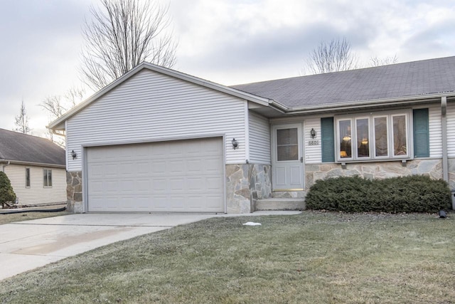 ranch-style home with a front lawn and a garage