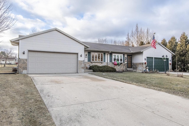 ranch-style home featuring a front lawn and a garage