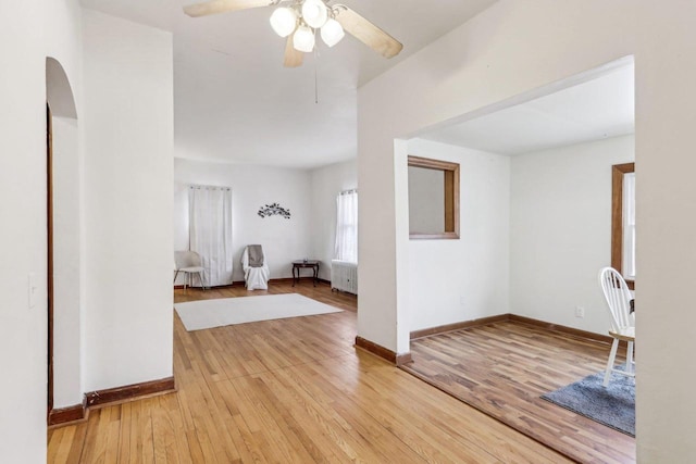 interior space with radiator heating unit and light wood-type flooring