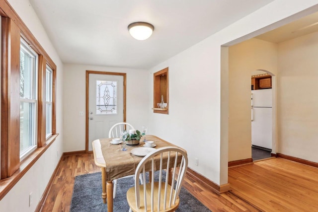 dining area with hardwood / wood-style flooring