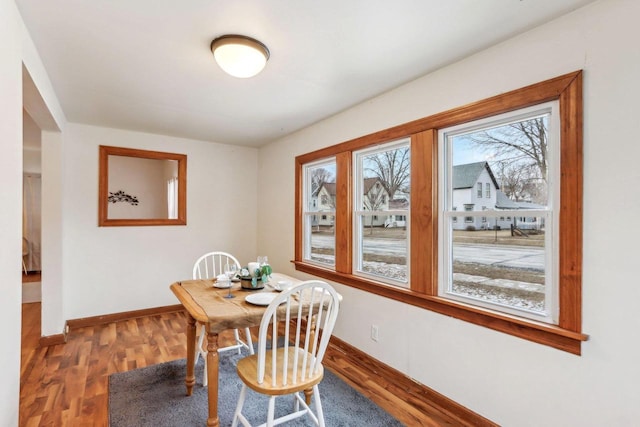 dining area with hardwood / wood-style floors