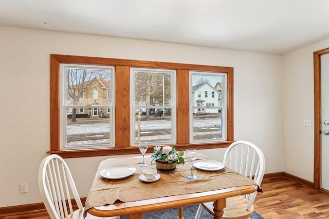 dining room with hardwood / wood-style floors