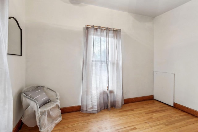 unfurnished room with light wood-type flooring