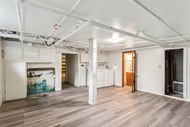 basement with independent washer and dryer and light wood-type flooring