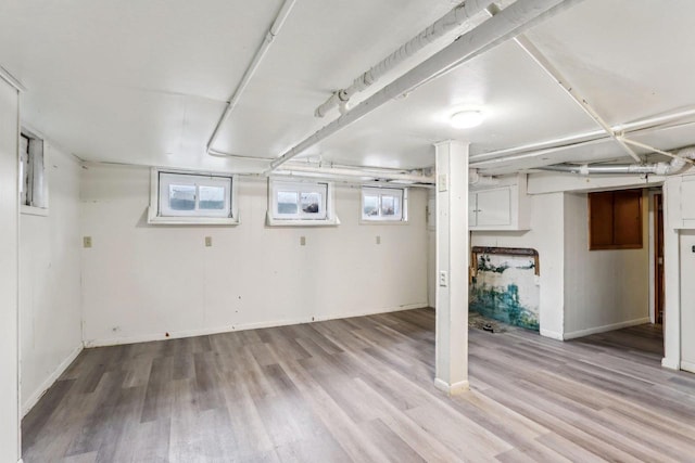 basement featuring light wood-type flooring