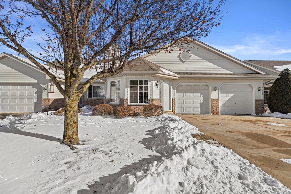 ranch-style house featuring a garage