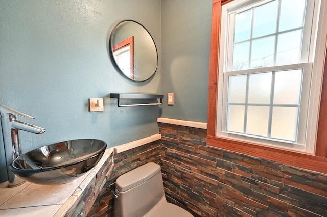 bathroom featuring sink and toilet