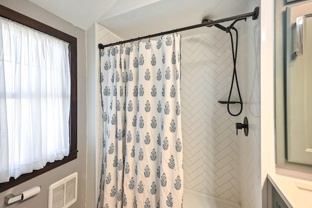 bathroom with a shower with curtain and vanity