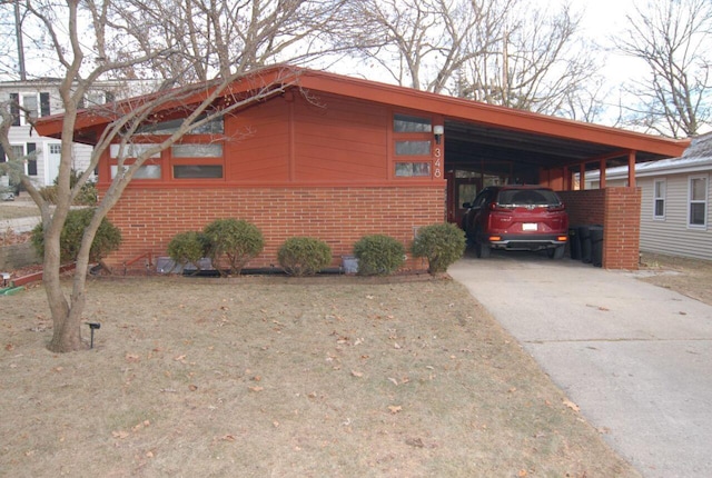 view of side of home with a carport