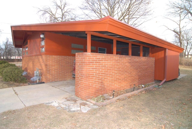 view of side of property with a carport