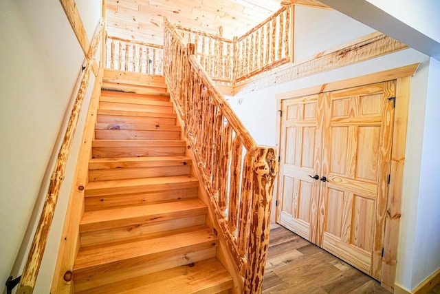 staircase featuring hardwood / wood-style flooring