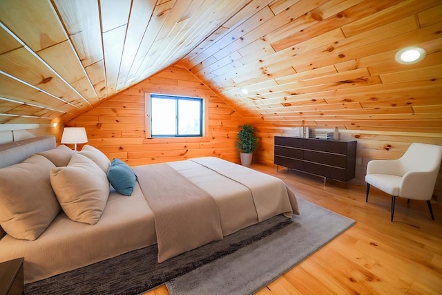 bedroom featuring wood ceiling, vaulted ceiling, wood walls, and wood-type flooring