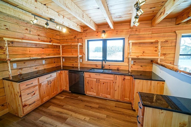 kitchen featuring sink, wooden walls, black dishwasher, and dark hardwood / wood-style floors