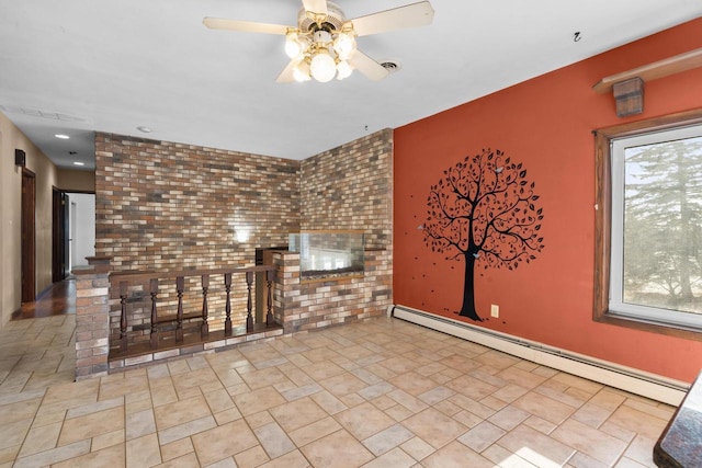 unfurnished living room featuring a baseboard heating unit and ceiling fan