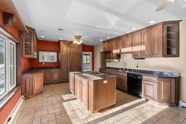 kitchen featuring sink, a center island, paneled built in refrigerator, dishwasher, and baseboard heating